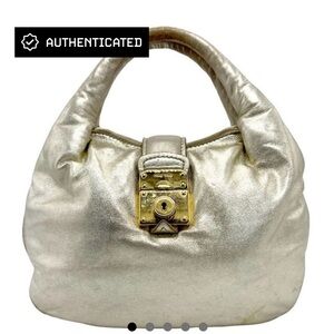 Miu Miu soft gold leather crescent shaped handbag. Super soft leather. AUTHENTIC